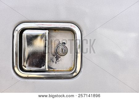 A Close Up Image Of The Door Handle On A Semi Truck.