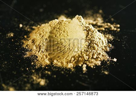 Jalapeno Green Chilli Powder on pink narble background