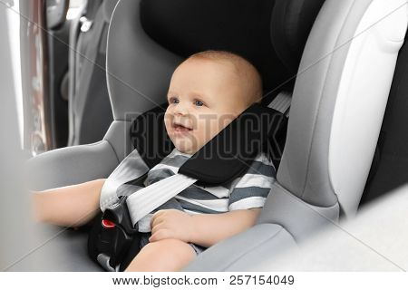 Little Baby In Child Safety Seat Inside Of Car