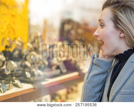 Woman Looking Something Interesting At A Shop Window