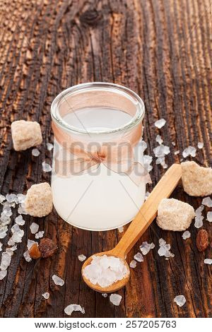 Tibi Crystal, Tibicos, Sugar Kefir Grains In Glass Jar With Sugar And Dry Fruit On Wooden Table.