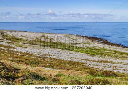 Fanore Beach In Burren Mountain With Aran Islands In Background