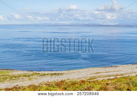 Fanore Beach In Burren Mountain With Galway Bay In Background