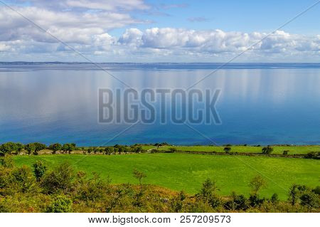 Farms In Burren Way Trail With Galway Bay In Background