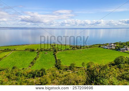 Farms With Cows And Horses In Burren Way Trail With Galway Bay