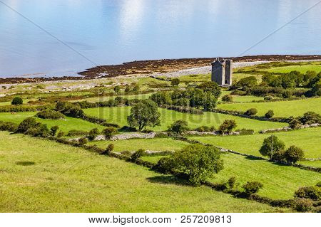 Old Rock Tower, Farm And Beach In Ballyvaughan