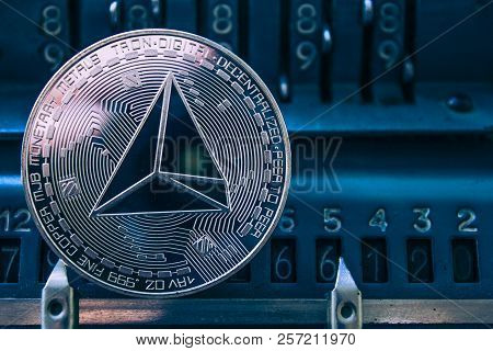 Coin Cryptocurrency Tron In The Background Of Figures Adding Machine. Concept Mining Or Tron Course.