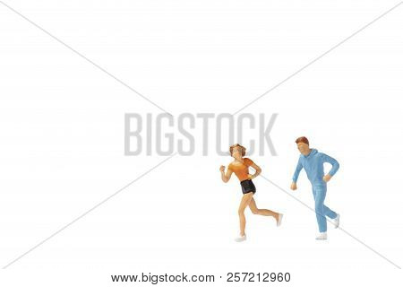 Miniature People : Couple Running On White Background , Healthy Lifestyle And Sport Concepts.