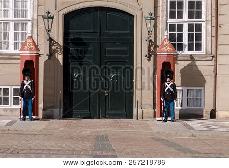 Copenhagen, Denmark - August 22, 2018: The Royal Guardsmen In The Traditional Uniform On Amalienborg