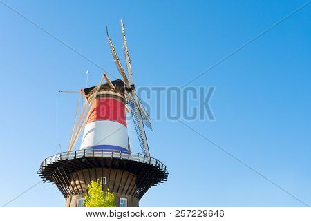 Windmill Of Leiden Wrapped In Netherlands Three Colored Flag, Holland