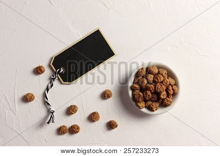 Tigernuts / Earth Almonds / Nutsedges On White Surface, With A Tag For Text