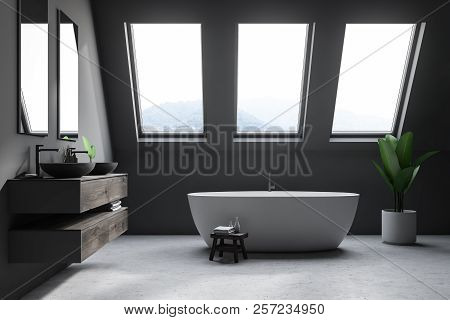 Luxury Attic Bathroom Interior In A Minimalisic Mansion With A Concrete Floor, Grey Walls, A Double 