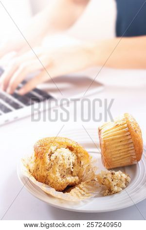 Women Are Eating Junk Food And Sweet Bread While Working.