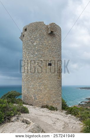 Watchtower On The Cliff In The Sea. Sierra De Irta In Peniscola. Castellon. Spain.