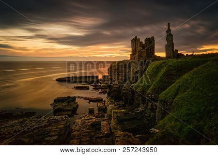 Castle Sinclair Girnigoe Cliffs On East Coast Of Scotland In Sunrise