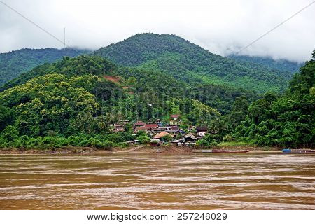 Local Village Set In The Jungle At Mekong River, Laos