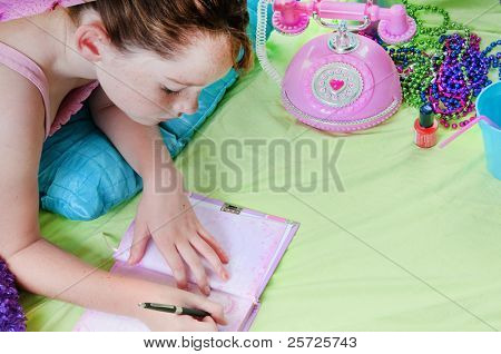 Girl writing in journal