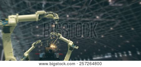 Iot Industry 4.0 Technology Concept.smart Factory Using Trending Automation Robotic Arms With Part O
