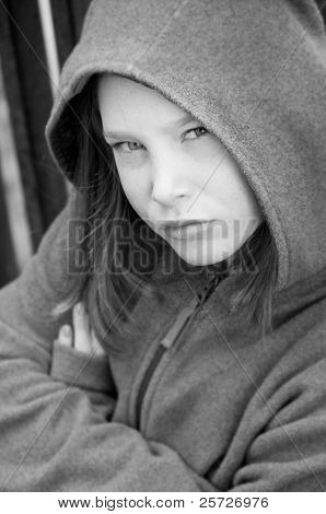 girl in hooded jacket outside