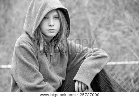 girl in hooded jacket outside