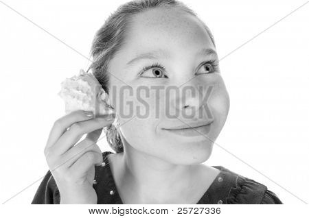 girl listening to seashell sounds