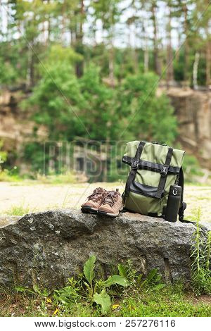 Set Of Camping Equipment On Rock Outdoors