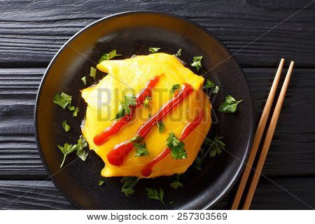 Japanese Cuisine: Omurice With Rice, Chicken And Vegetables Close-up. Horizontal Top View
