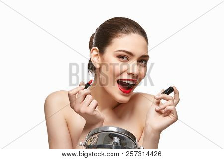 Girl Applying Red Lipstick Isolated On White