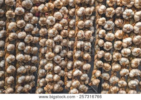Rope With Garlic At The Market Stall