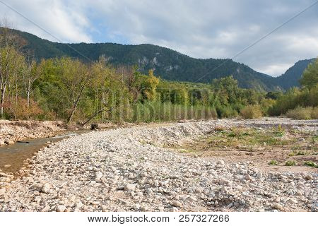 Bright Autumn Day On The Forest River. Kurdzhips River In The Krasnodar Region.
