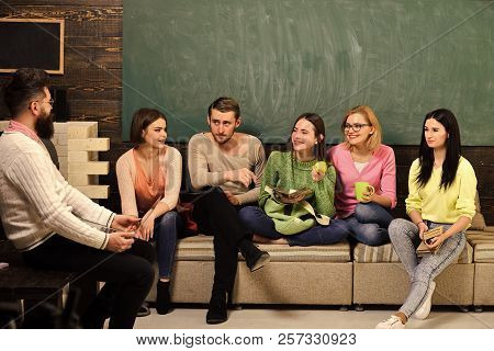 College And University Concept. Group Of Students, Group Mates Listening Teacher, Lecturer, Professo