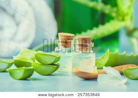 Aloe Vera Extract In A Small Bottle And Pieces On The Table. Selective Focus.