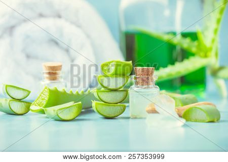 Aloe Vera Extract In A Small Bottle And Pieces On The Table. Selective Focus.