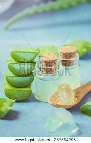 Aloe Vera Extract In A Small Bottle And Pieces On The Table. Selective Focus.