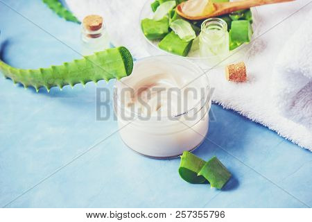 Aloe Vera Extract In A Small Bottle And Pieces On The Table. Selective Focus.