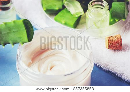 Aloe Vera Extract In A Small Bottle And Pieces On The Table. Selective Focus.