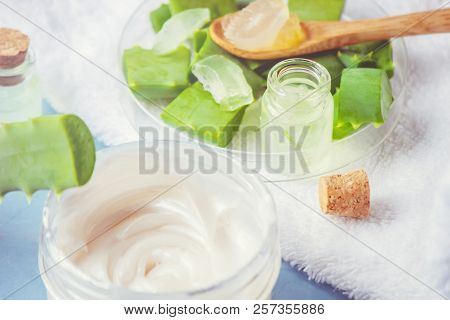Aloe Vera Extract In A Small Bottle And Pieces On The Table. Selective Focus.