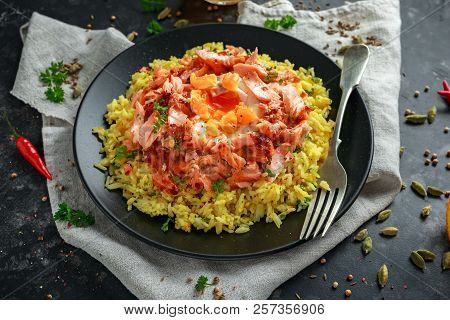 Traditional Indian-english Kedgeree Breakfast: Basmati Rice With Egg Benedict And Hot Smoked Sweet C