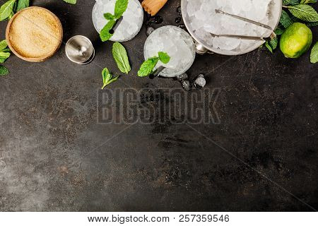 Metal Ice Bucket And Mojito Ingredients On Dark Background