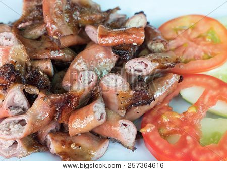 Roasted Pork Chitterlings In The Traditional Thai Style Served With The Fresh Vegetable.