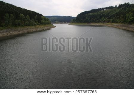 Okerstausee Near Goslar In The Harz.
The Reservoir Has Little Water In The Summer Of 2018 After A Lo