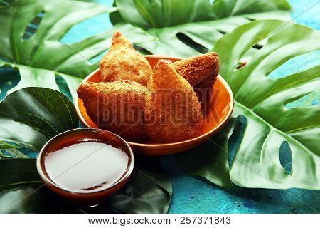 Coxinha Street Food. Brazilian Chicken Coxinha Over Rustic Background.