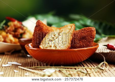 Coxinha Street Food. Brazilian Chicken Coxinha Over Rustic Background.
