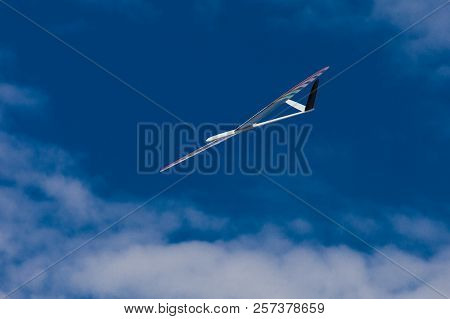 Rc Remotely Controlled Soaring Plane Model Sailplane On Blue Sky In Brisk Wind