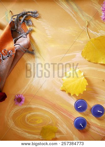 Yellow Leaves, Orange Tippet, Candles On Toned Paper Painted With Pastel, Top View, Concept Of Autum