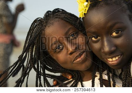 Orango Island, Guinea-bissau - February 2, 2018:  Portrait Of Two Beautiful Young Girls At The Beach
