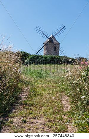 Windmill In A Field In Plogoff In Summer