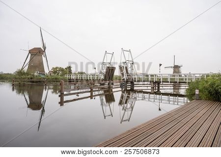 In Kinderdijk In The Netherlands This Beautiful Drawbridge Is Attached To The Windmill