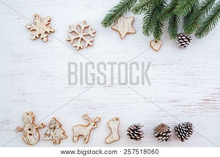 Christmas Background - Fir Leaves And  Rustic Elements Decorating On White Wood Table. Creative Flat