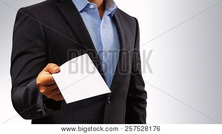 Management Submits An Envelope To Employees. Businessman